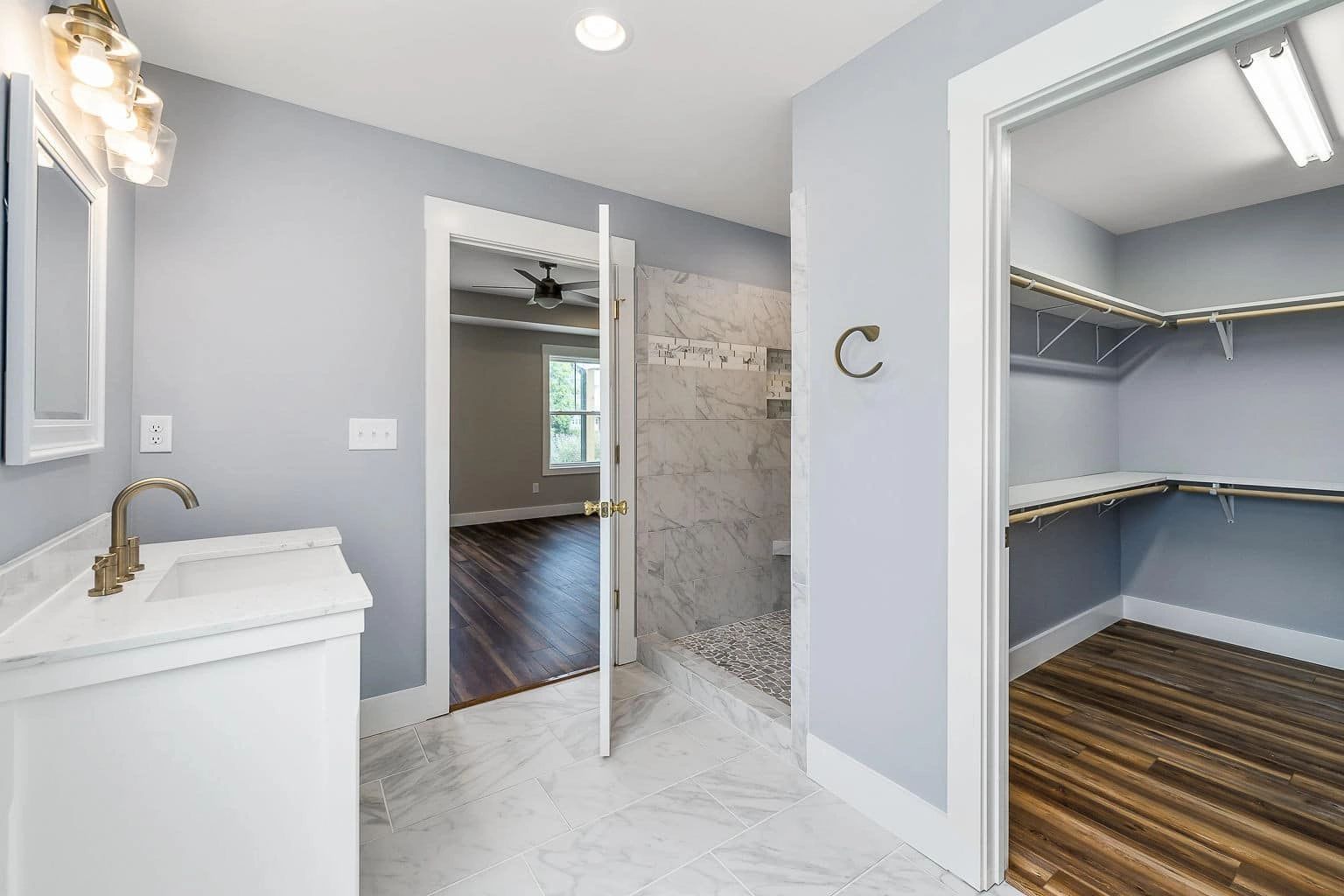 Walk-in shower with marble tile
